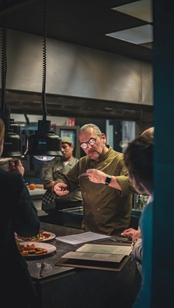 Chef in action instruction his team.
